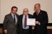 Dr. Nagib Callaos, General Chair, giving Dr. Sebastião Helvecio Ramos de Castro the best paper award certificate of the session "Accountability e Democracia." The title of the awarded paper is "Utilização do Big Data no Impacto de Políticas Públicas."